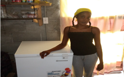 Woman with freezer in Haiti